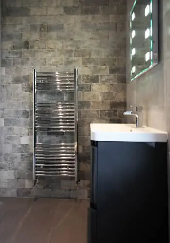 Matching towel rail fitted in Sheffield bathroom
